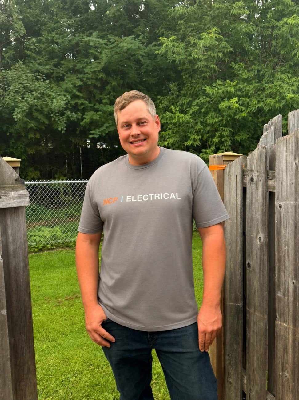 Mike Fulcher, owner of NCP Electrical, wearing an NCP Electrical shirt