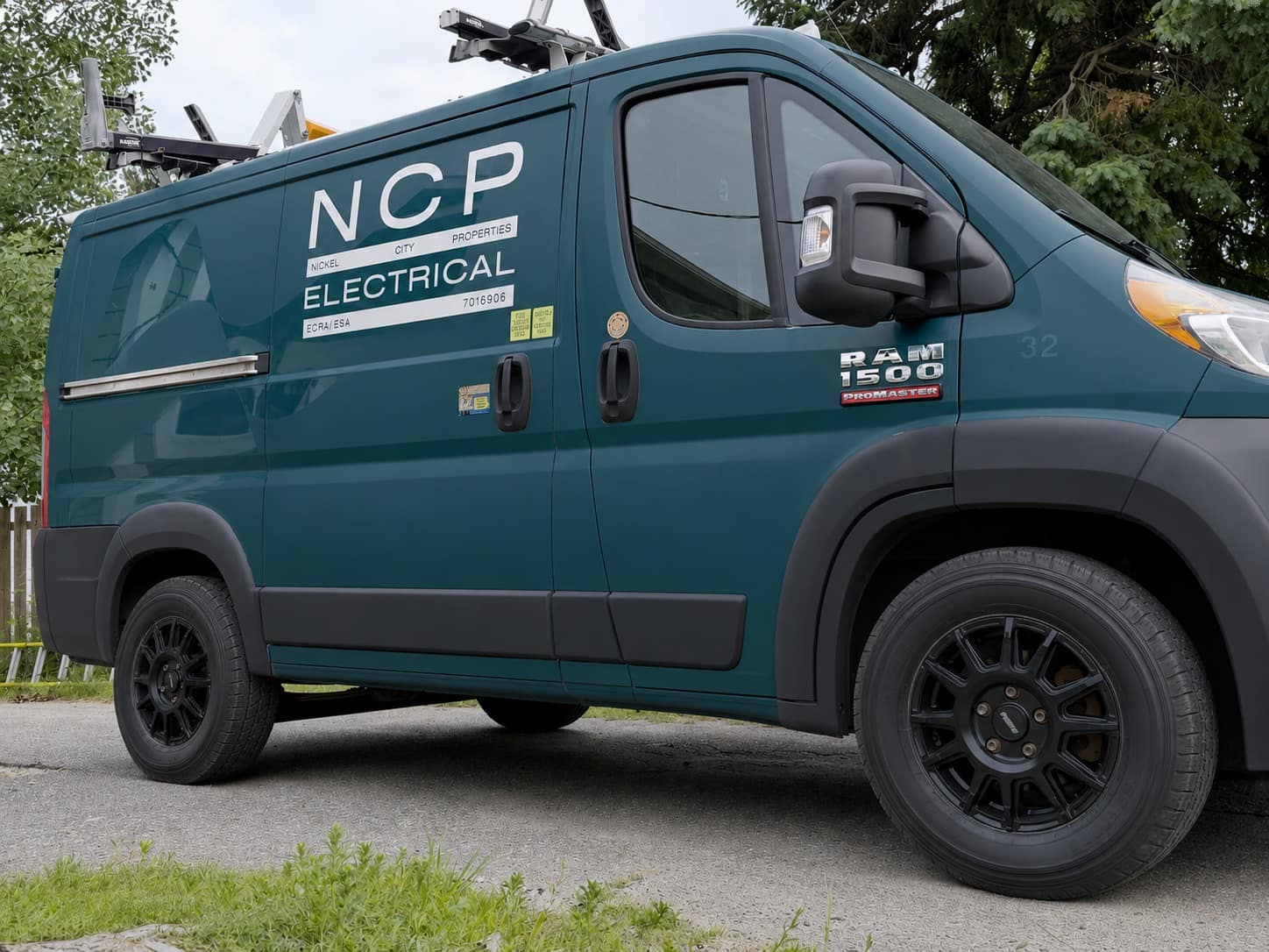 NCP Electrical's work van — a RAM ProMaster with ladder rack — parked on a job site in Greater Sudbury